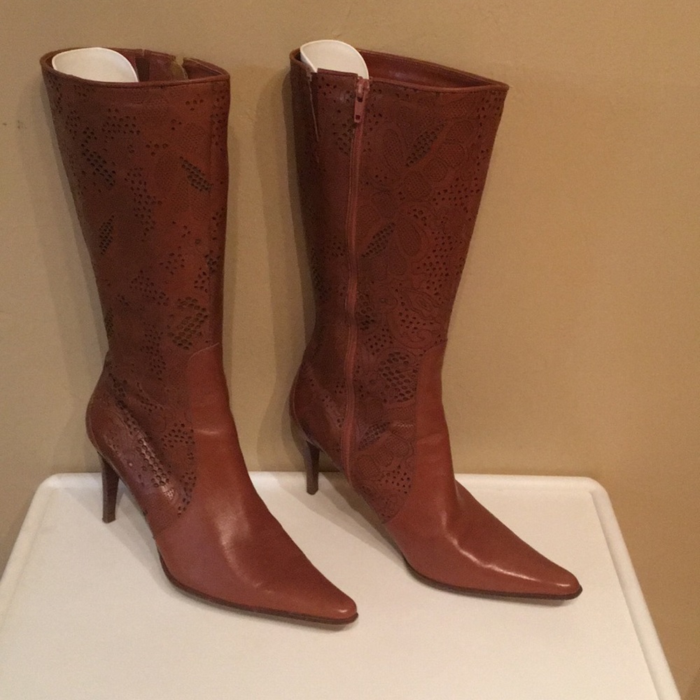 Hi heel pointy boots. Worn but in good condition.